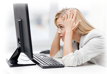 stressed woman at a computer